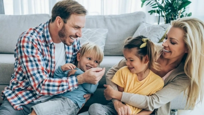 a happy family in a living room of a new home